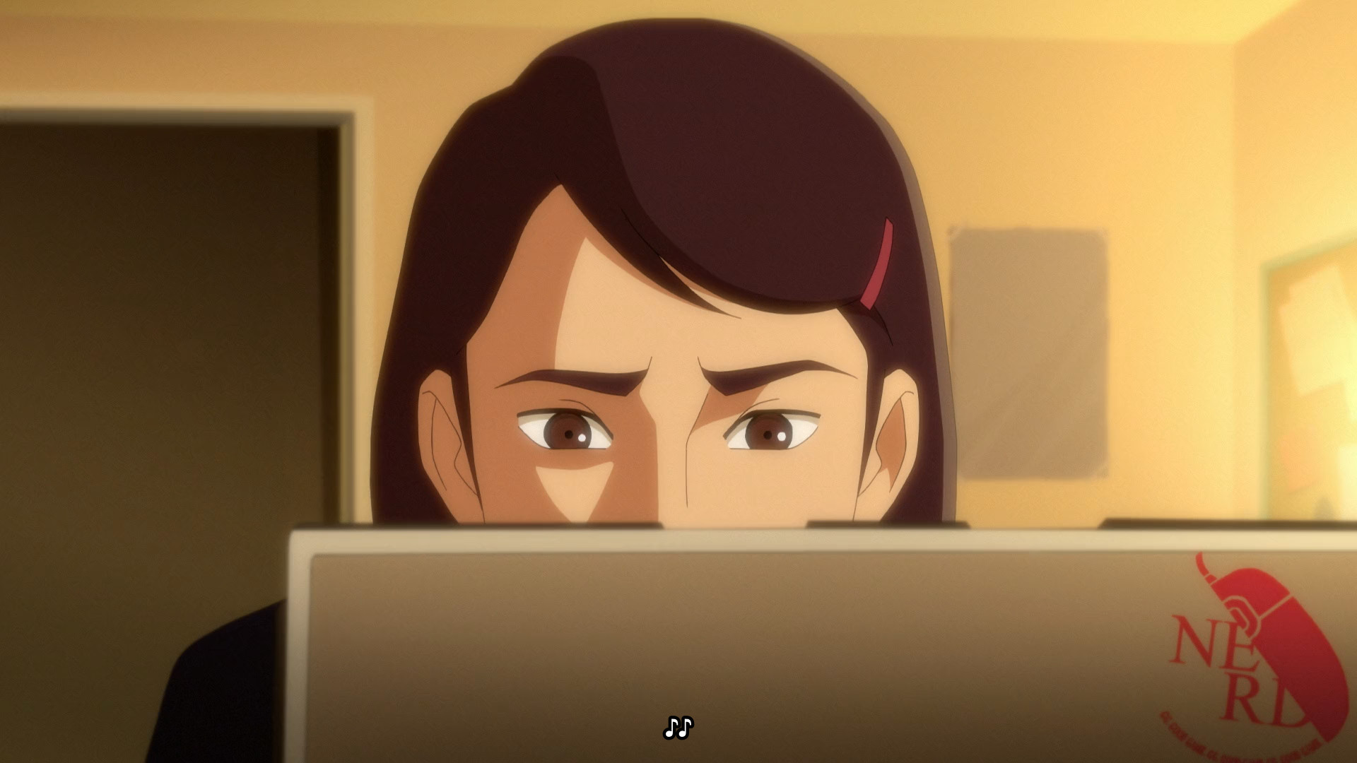 A laptop with a sticker that says "NERD", styled after the logo of Neon Genesis Evangelion's NERV